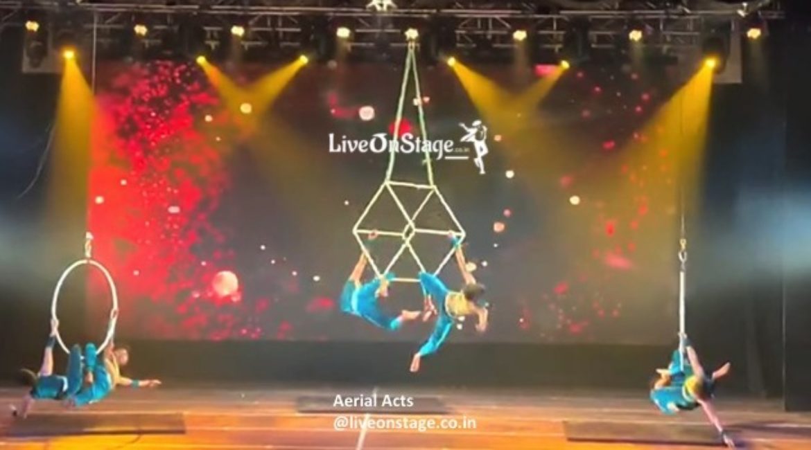 Aerial Silk, Aerial Cube, Aerial Rope, Aerial trio, Aerial duo, Aerial swinging act, Aerial Stunts, Flying Stunts, Multiple Aerial Performers, Stage Shows, Aerial Show Production, Live On Stage, Live On Stage Weddings, Product Launch, Bollywood Movies, Television Shows, Ad Commercials, Aerial Trapeze Act,